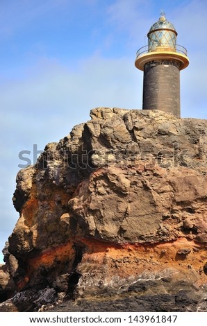 Stone lighthouse on the cliffs, tip of Jandia, coast of Fuerteventura, Canary islands, Spain