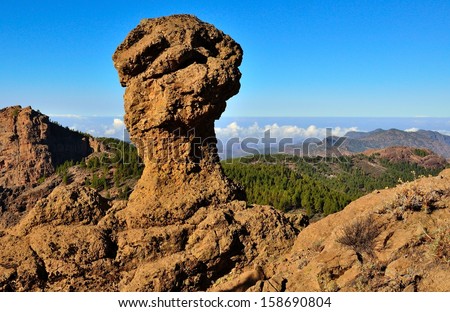 Natural landscape with big rock between mountains and blue sky, interior of Gran canaria, Canary islands