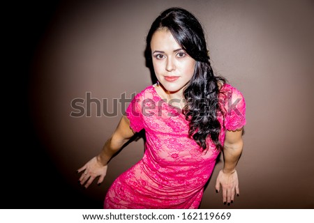 beautiful brunette in a pink dress