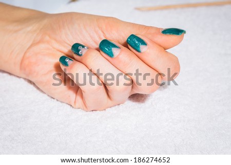 Manicure treatment in cosmetic salon
