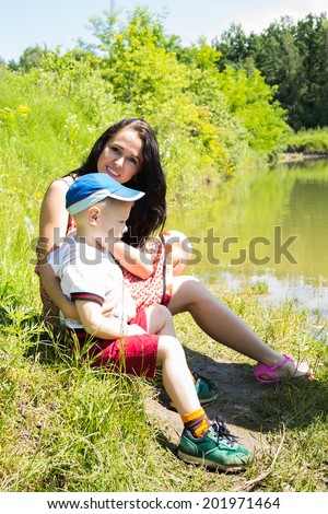 mom with son near the lake