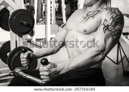 Muscle man with tattoos.Black and white