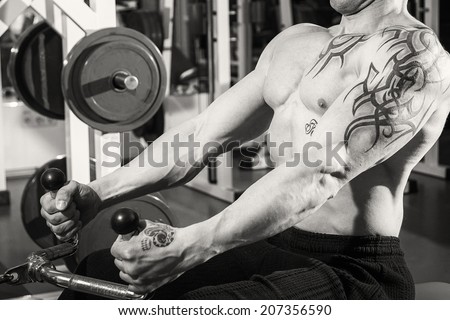 Muscle man with tattoos.Black and white
