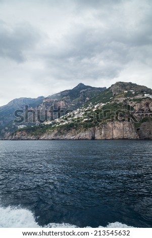 Beautiful town seascape. View of the beautiful city with colorful houses and boats. City, sea, landscape, Italy, Amalfi. Use in articles about Italy and marine leisure.
