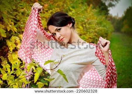 Young woman in beautiful autumn park, concept autumn.Autumn woman on leafs background