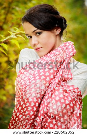 Young woman in beautiful autumn park, concept autumn.Autumn woman on leafs background