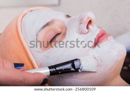 Medical cosmetic procedure. Mikronidling. Beautician performs Dermaroller procedure.young beautiful woman having an injection mesotherapy.cosmetic procedures in spa clinic.