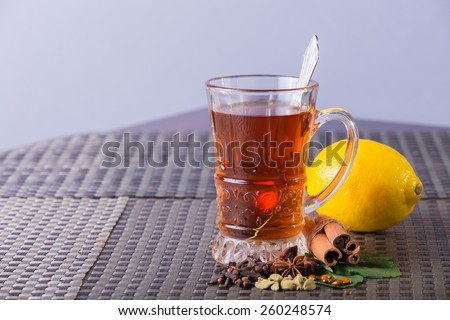 Tea with lemon. Tea on a light background. Warm, delicious tea.