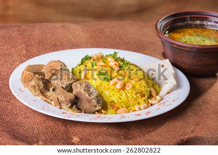 Pilaf cooked in Arabic. Pilaf with meat. Pilaf with special soup. Arab food. Eastern food.