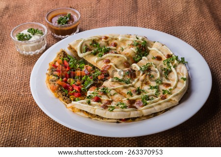 East cuisine. Eastern food. Pita bread with vegetables and meat. Oriental meat cakes. Delicious food.