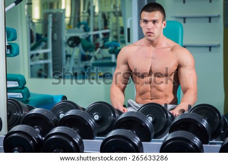 The process of power exercise. Sports. The process of exercises with dumbbells. Healthy lifestyle concept. Fitness, bodybuilding, strength, youth, health.