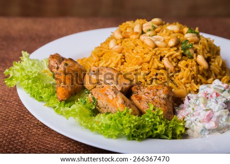 Eastern food. Arab food. Pilaf with meat. Rice with meat and vegetables. Healthy eating, delicious food.