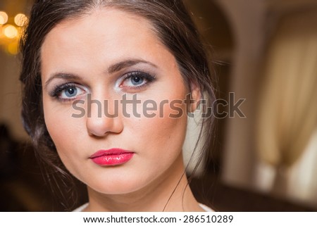 Beautiful girl. Beauty Photo. Girl with a chic makeup. Red lips, expressive eyes. Work up artist.
