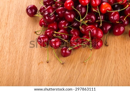 Red cherries. Cherry as background / full frame. fresh cherries on a wooden table