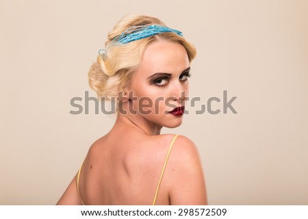 Portrait of a gorgeous blonde. The mystery, sadness, insecurity, human emotions. The girl in the style of the 20s.