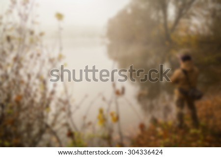 Fishing in the fall. blurred Background