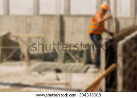 Construction, construction workers on site. blurred Background