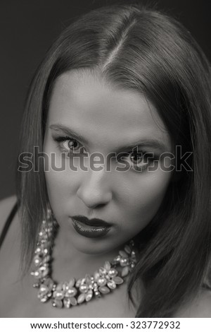 Portrait photo seductive woman. Black and white photos for magazines and advertising posters. Model posing seducing the viewer.