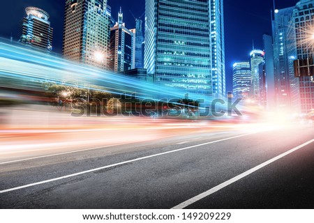 The Light Trails On The Modern Building Background In Shanghai China.