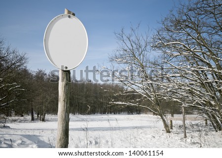 Empty sign in the nature in winter. You can put any text on it.
