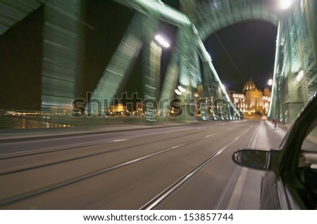 Blurred motion picture of bridge from moving car