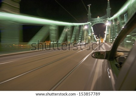 Blurred motion picture of bridge from moving car