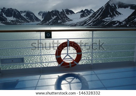 Glacier in magdalenen fjord, arctic circle, as seen from the deck of the ship, backlit