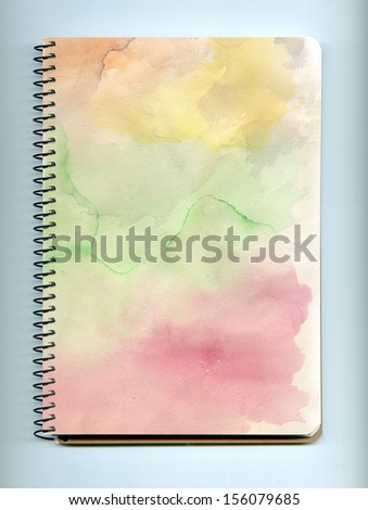 Blank realistic spiral notepad notebook on white background. Watercolor texture.