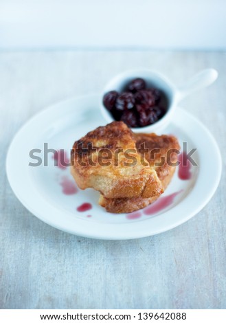 breakfast - pieces of toasted bread and cherry jam