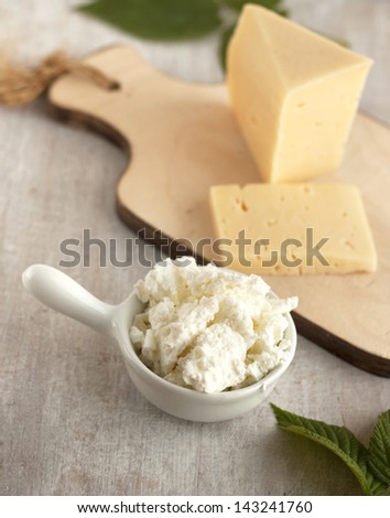 cottage cheese in the white gravy boat and chees