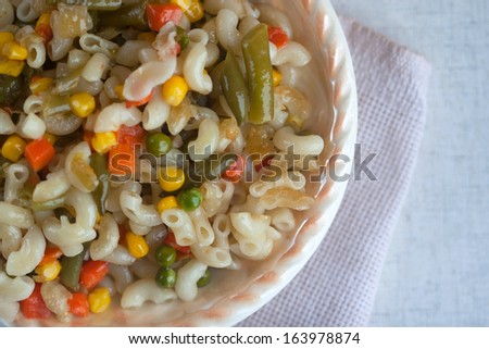 macaroni with vegetables - corn, peas, leguminous haricot