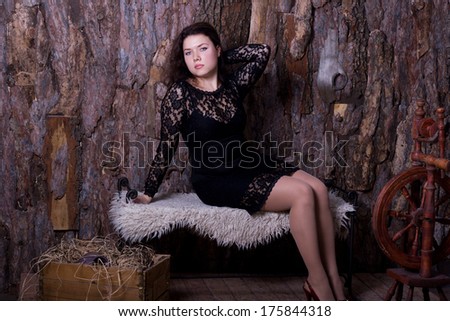 Pretty young woman in a lace dress of the rural surroundings