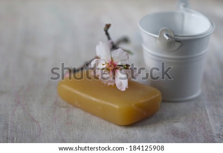natural soap, spring blooming branch and decorative small bucket