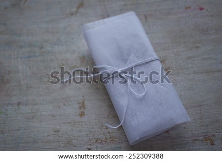 White paper folds on a light wooden background