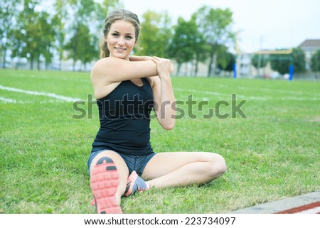 training stretching woman grass