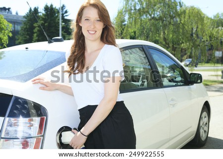 A woman who Put Energy on Hybrid Vehicle