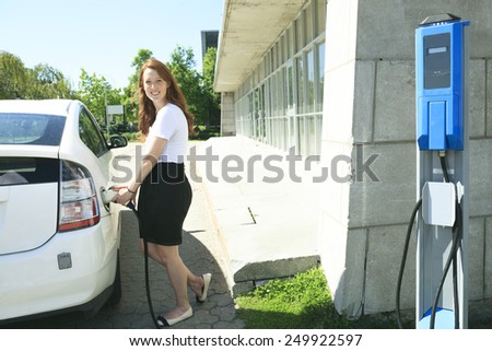 A woman who Put Energy on Hybrid Vehicle