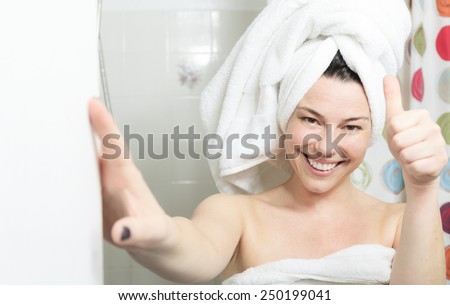 Shower woman. Happy smiling woman washing shoulder showering in bathroom.
