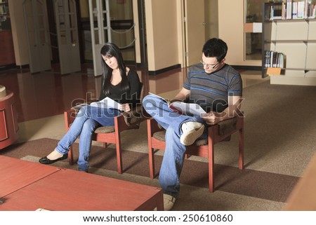 A 20 years old couple student studying.