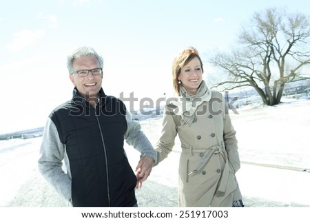 Portrait of happy senior couple in winter season