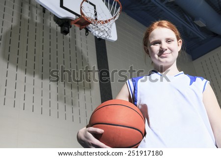 A teenager basketball player play his favorite sport