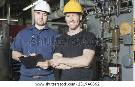 repairman engineer or inspector who check the system.