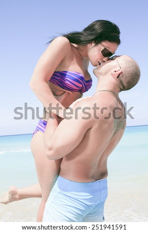 A beautiful couple on a tropical beach cuba