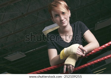 fitness woman doing punching exercises in training place