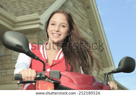 happy girl riding scooter enjoy summer vacation