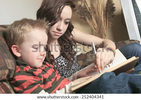 A Babysitter Writing something on a book
