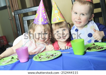 A children birthday with the kid eat cake.