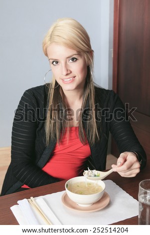 A social girl in a sushi restaurant