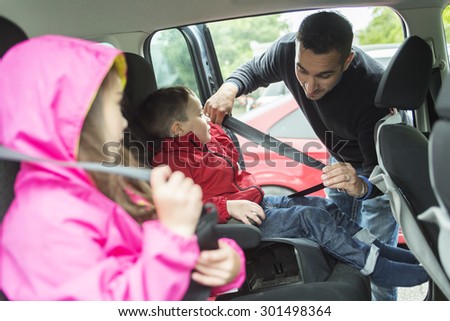 A Father worried about her children\'s safety in a car
