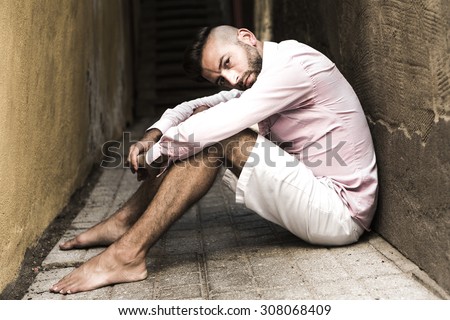 A Portrait of young, depressed man in pain